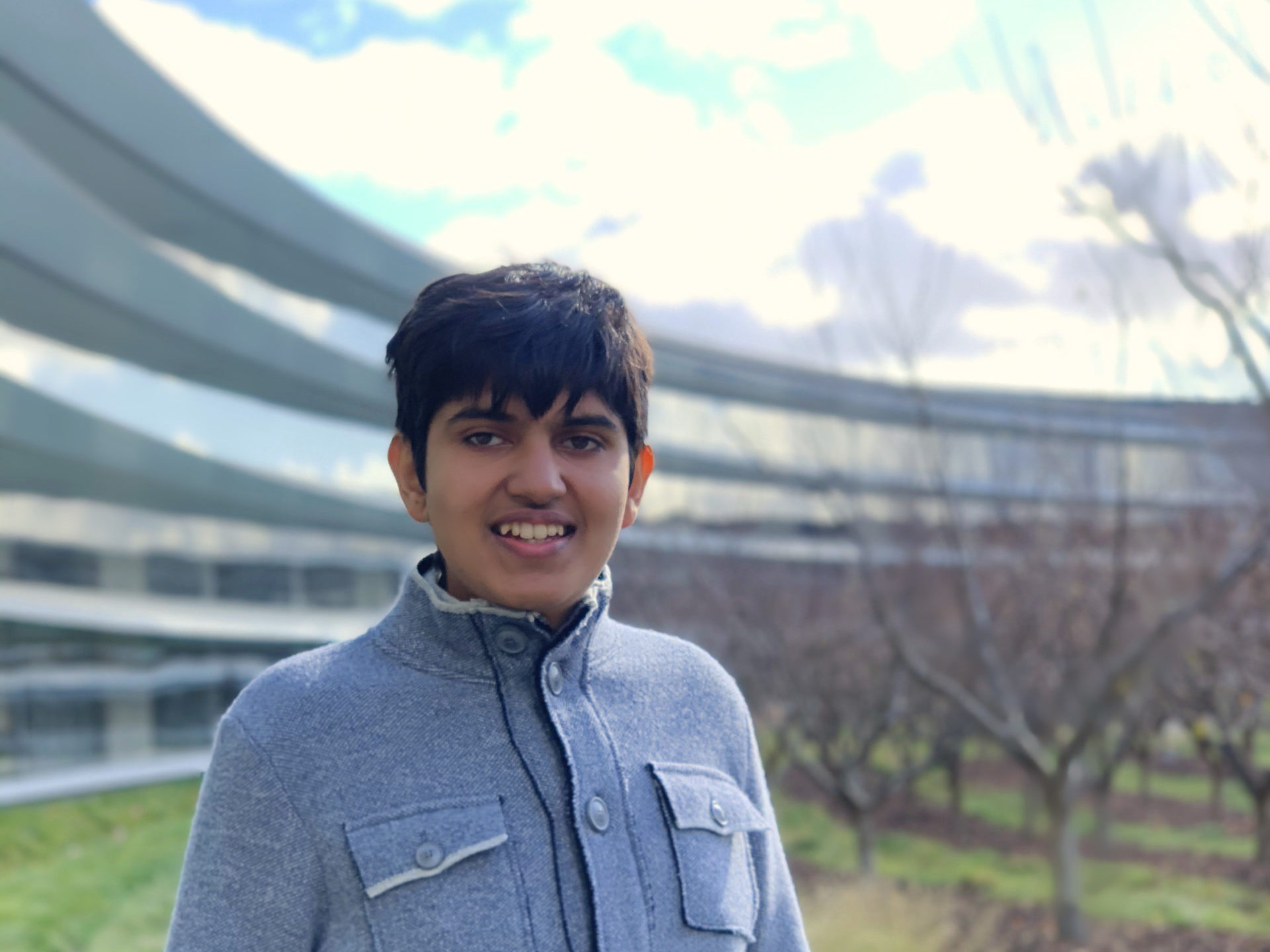 Vardhan Agrawal on the inner part of the Ring Building at Apple Park next to the apple orchard during an invite-only event